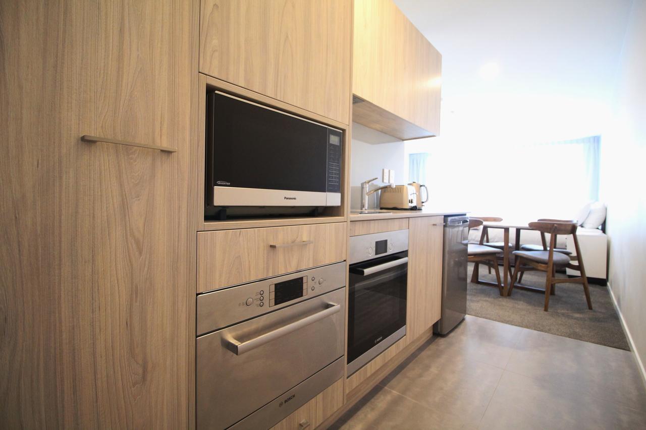 FERNZ Motel&Apartments Birkenhead Auckland Zimmer foto A kitchen in a student apartment at the University of Melbourne